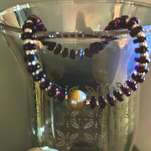 Garnet and silver seed bead bracelet.